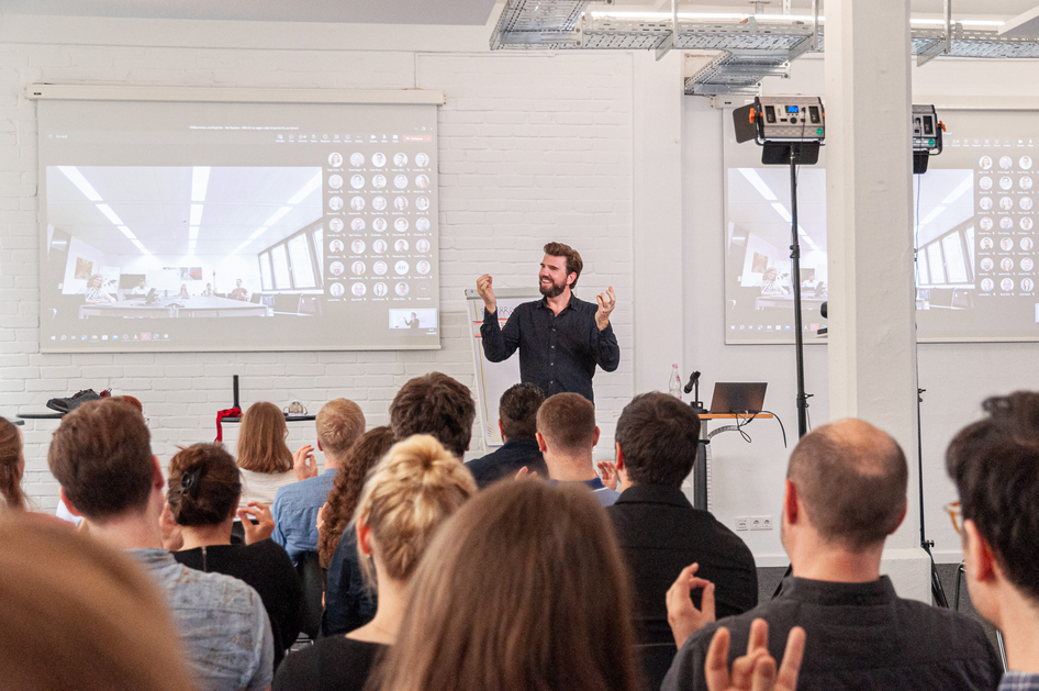 Colleagues during a presentation at the project conference